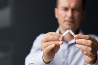 man breaking a cigarette in half (2)