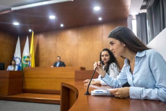 A person testifying in court.