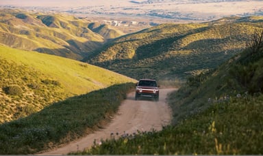 Rivian on scenic dirt road