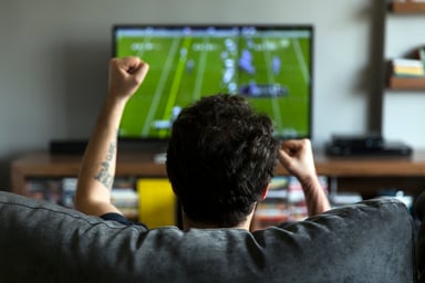 GettyImages-man watching football on tv