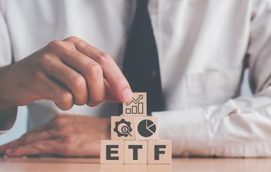 ETF on blocks businessperson stacking