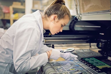 technician-inspecing-circuit-board