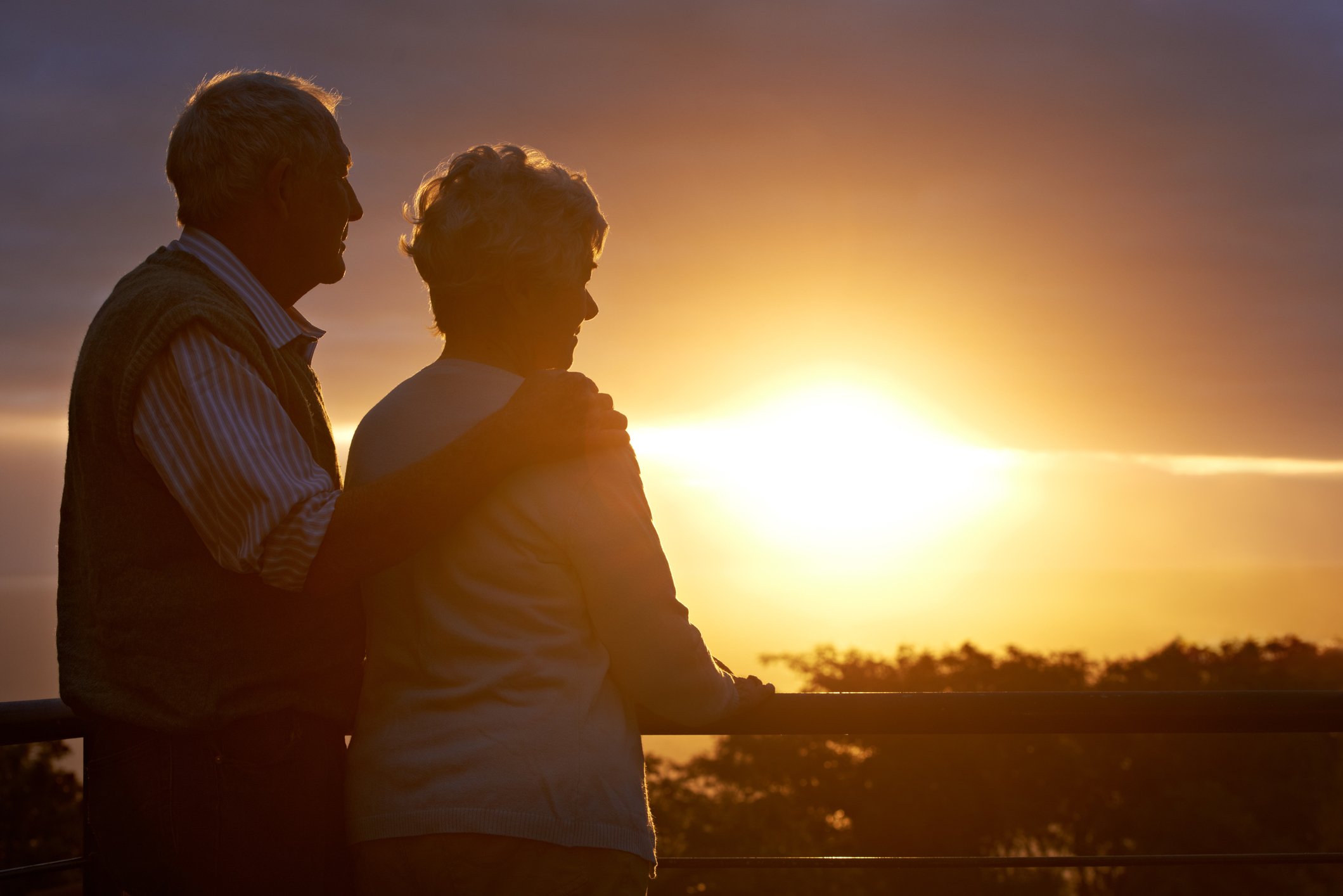 older couple watching sunset