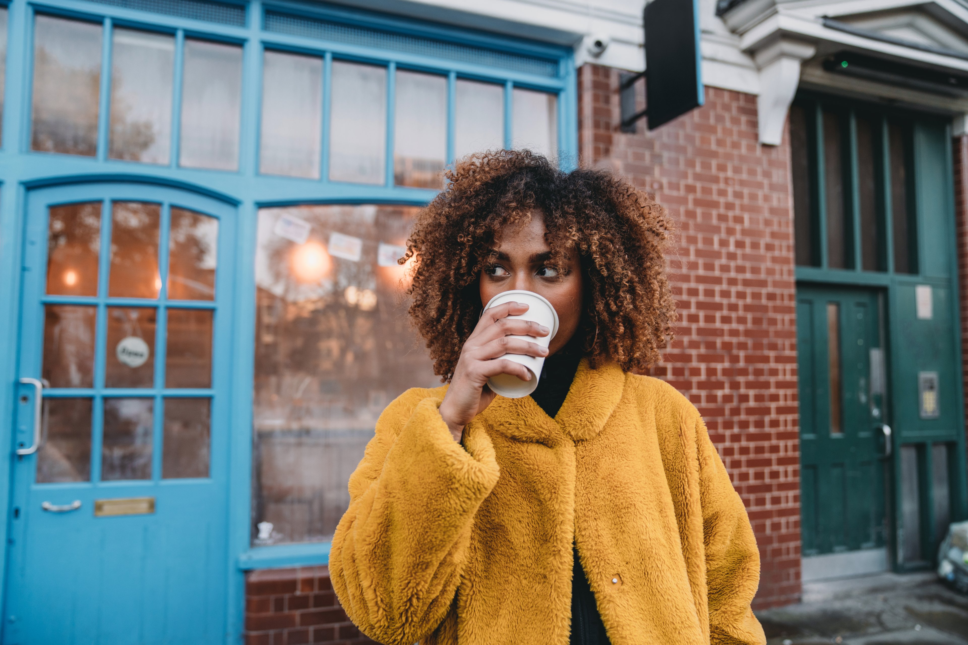 drinking hot chocolate at a coffee shop in winter