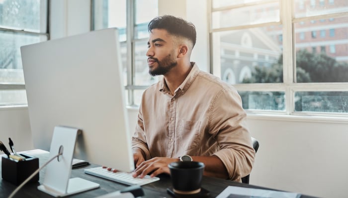 A person at a computer.