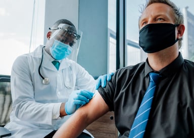 Person receiving a vaccine shot
