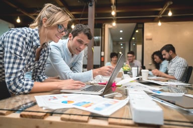 People reviewing data on a computer.