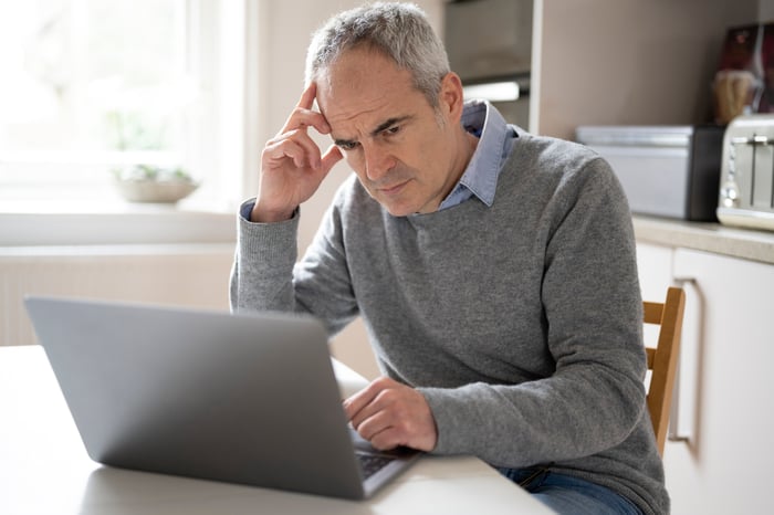 A person at a laptop.