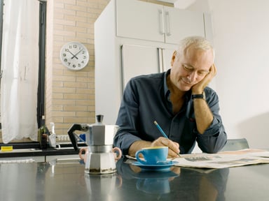 Man sitting at a table writing