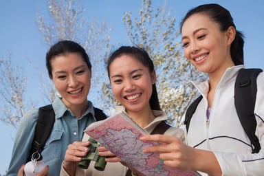 Asian Family holding map