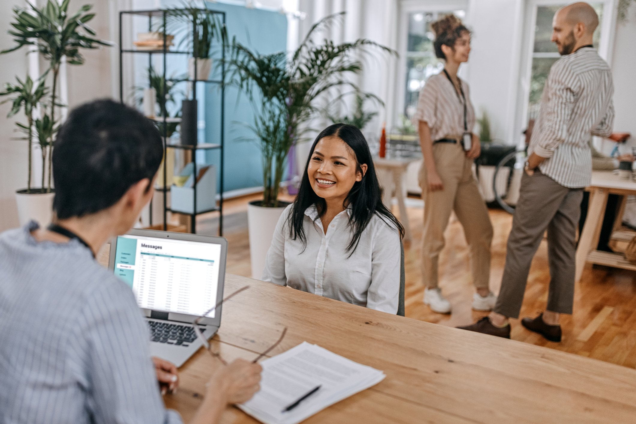 A smiling person interviewing for a job