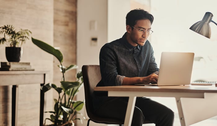 A person at a laptop.