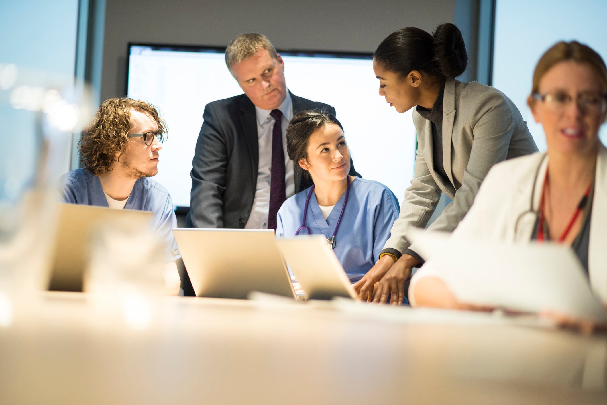 medical staff talk with management