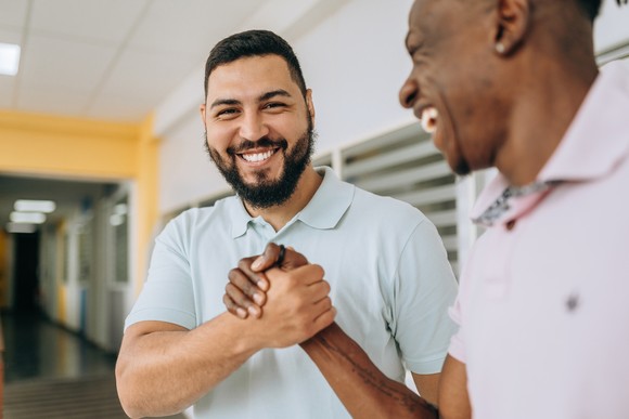 Two people shaking hands.