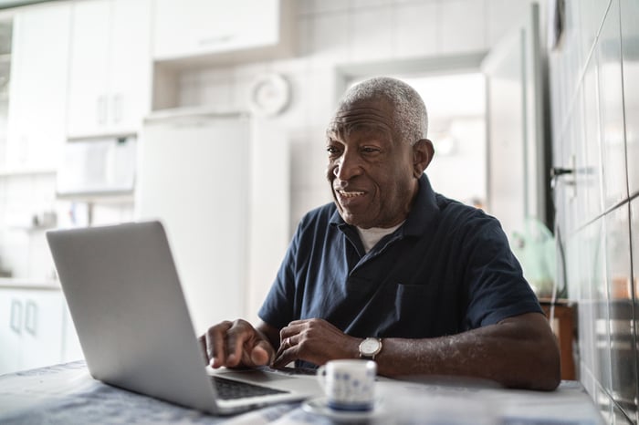 A person at a laptop.