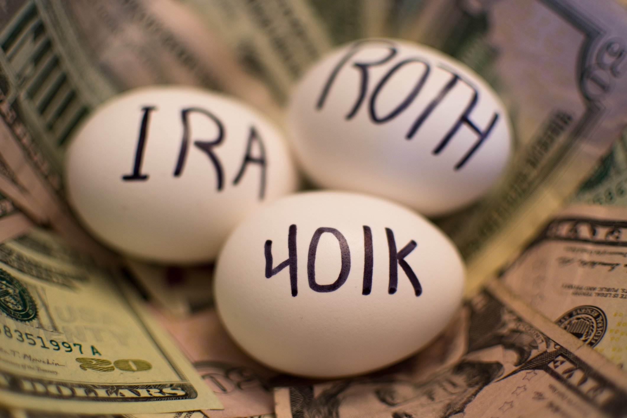 IRA, Roth, 401(k) eggs in a nest.