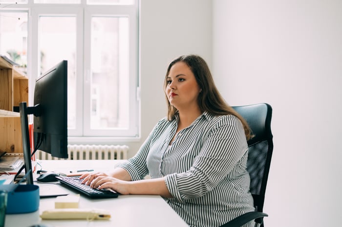 A person at a computer.