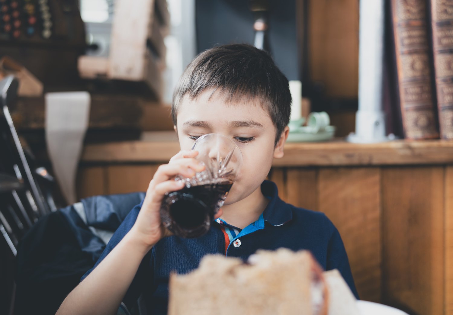 a child drinks a coke