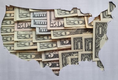 Map of US - covered in money - GettyImages-1173484375