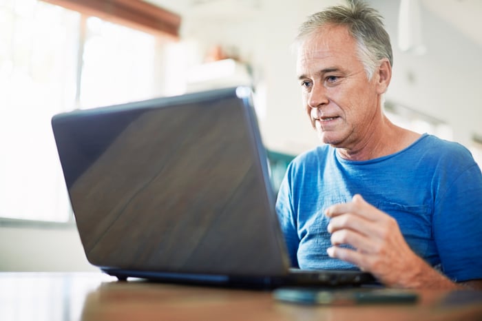 A person at a laptop.