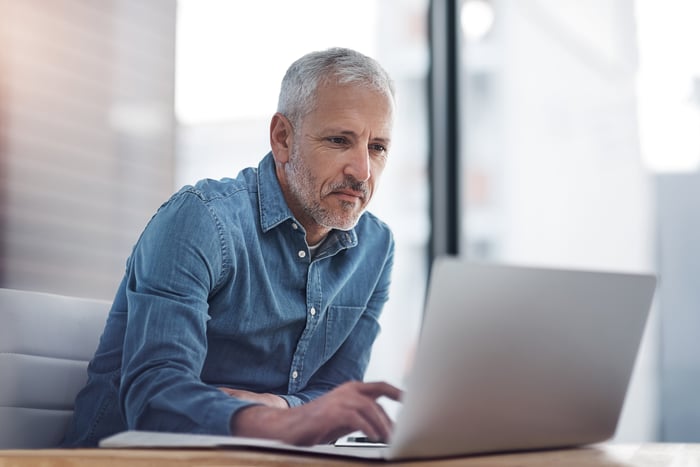 A person at a laptop.