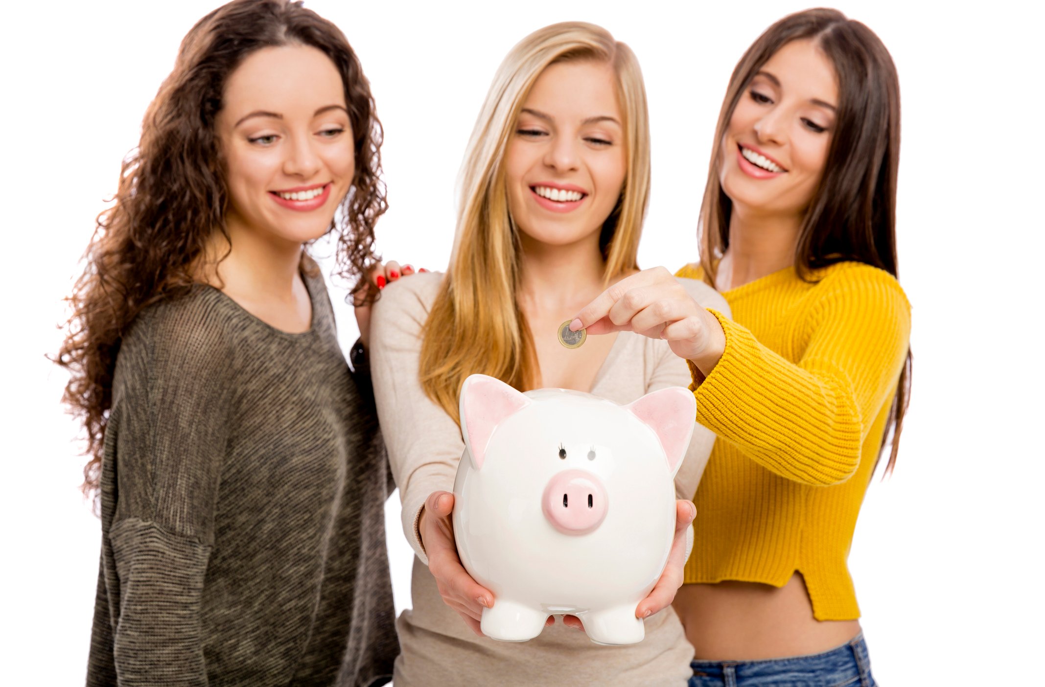 Three people putting change into a piggy bank