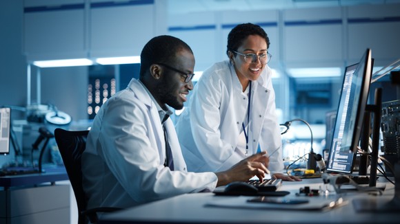 People working in a laboratory developing semiconductor chips.