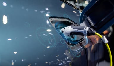 close up of plugged in electric vehicle getty