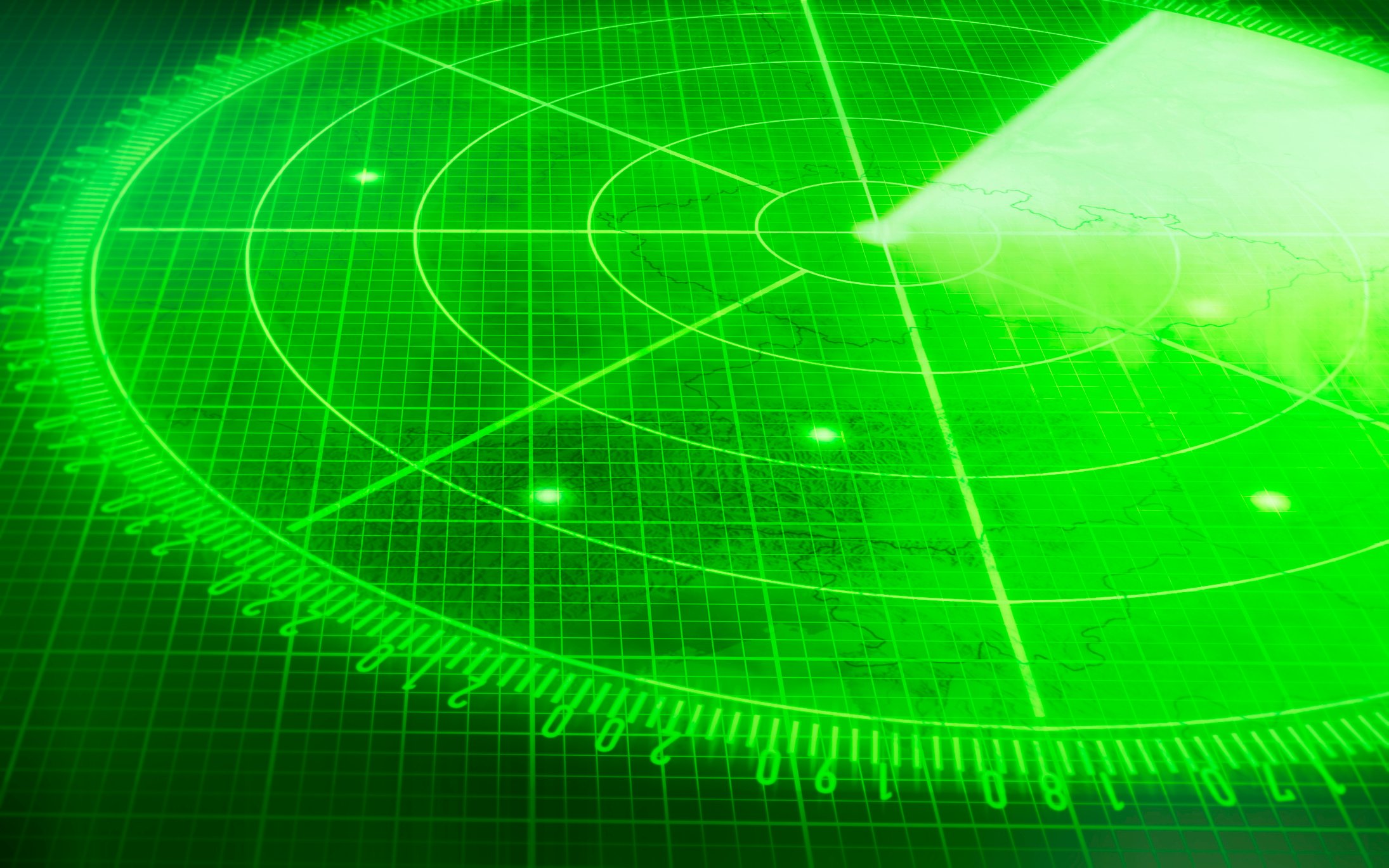 Green radar screen with multiple blips