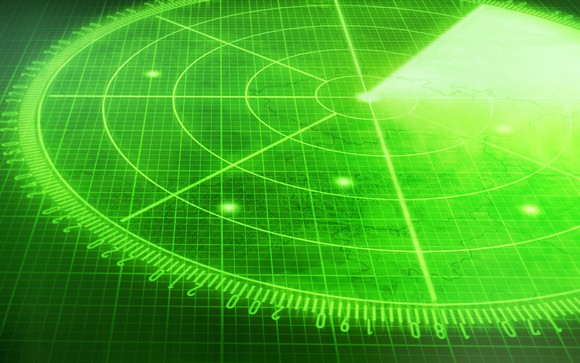 Green radar screen with multiple blips.