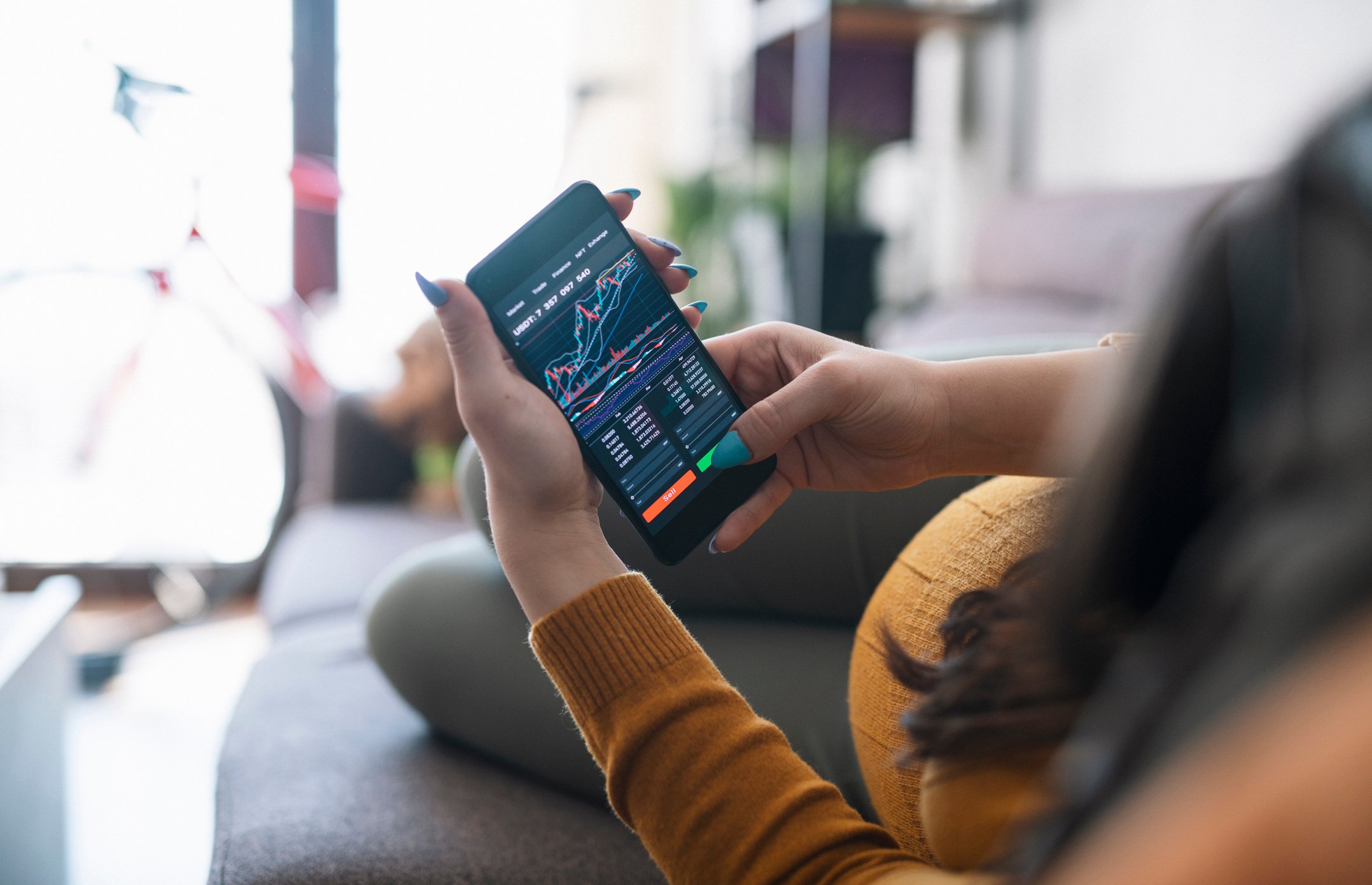looking at stock chart on smartphone.