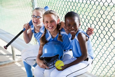 little girls softball team dugout