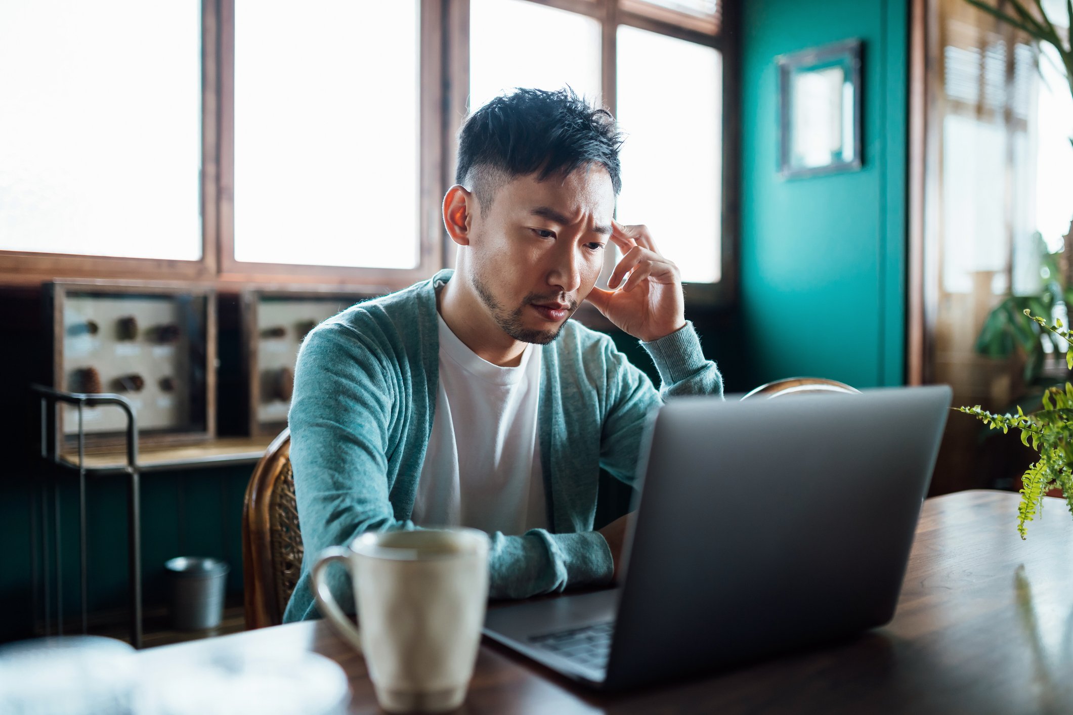 Getty - concerned unhappy person staring at laptop