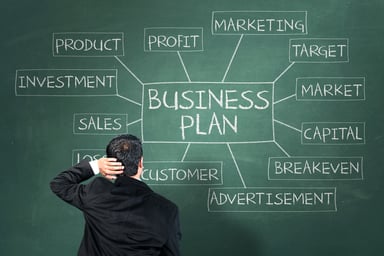 Inexperienced man learning about business plan