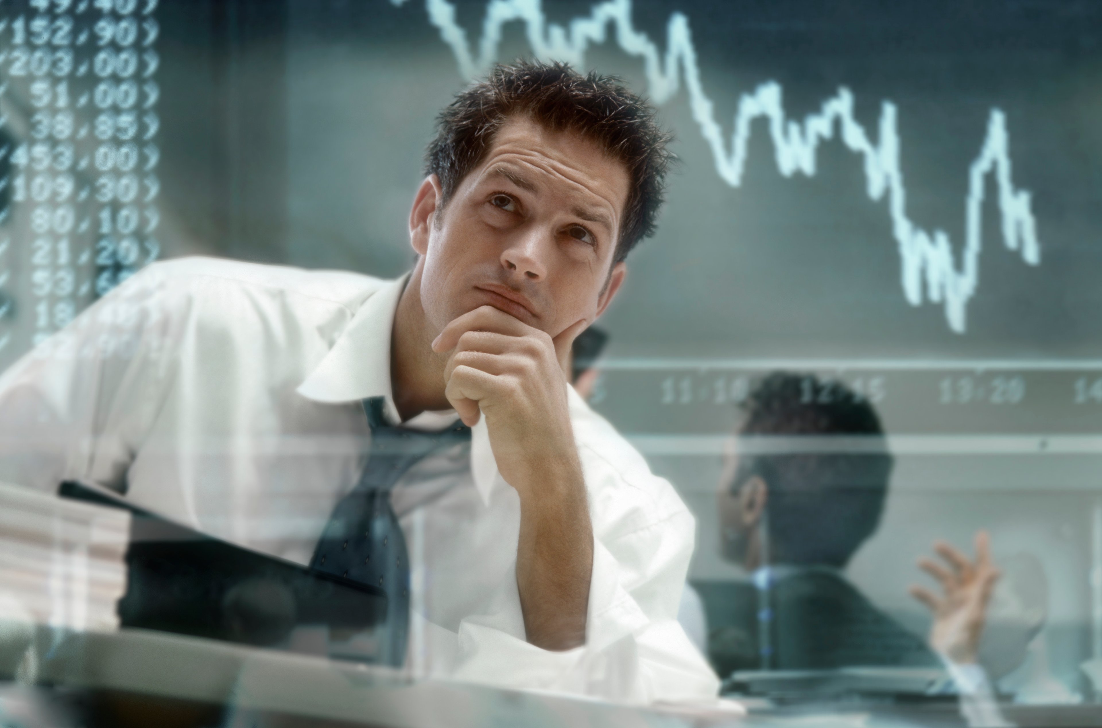 frustrated investor with stock chart going down