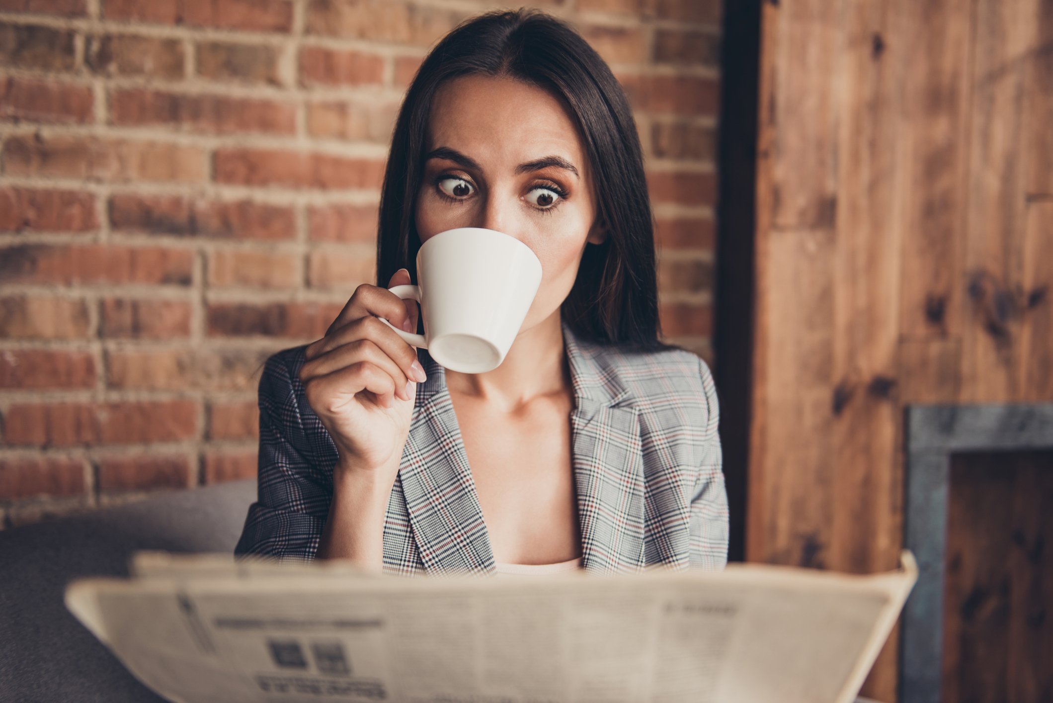 astonished shocked coffee newspaper