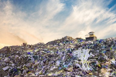 A bulldozed sits on a landfill