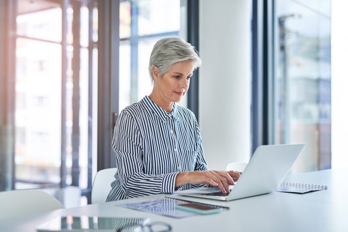 A person at a laptop.