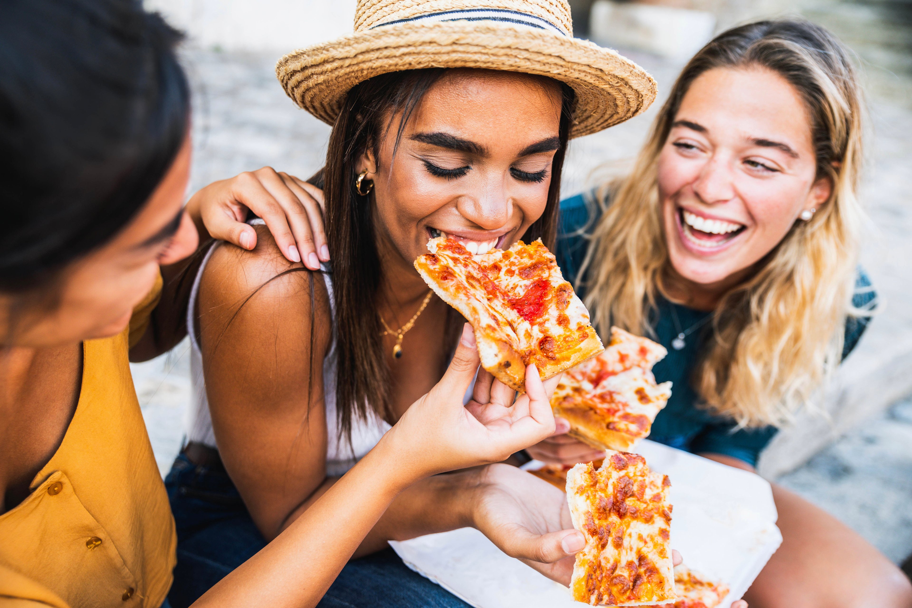 friends having pizza lunch 