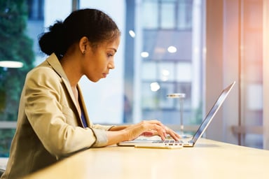 investor works on laptop in office