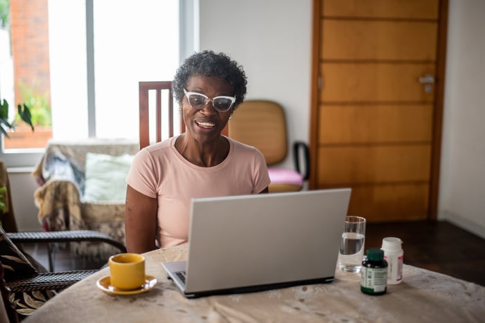 A person at a laptop.