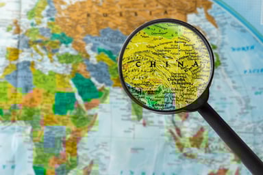 Map of China under a magnifying glass.