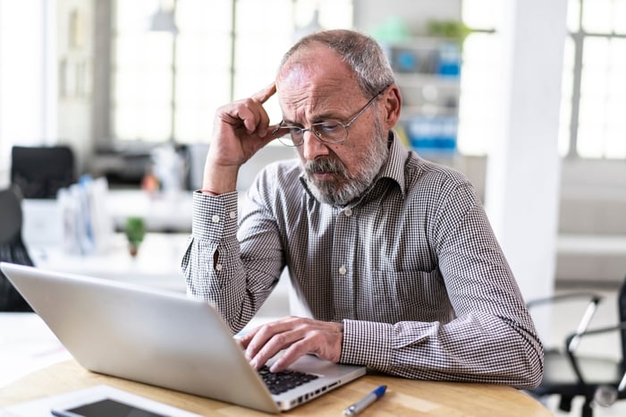 A person at a laptop.