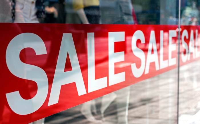 Sale banners in front of a store.