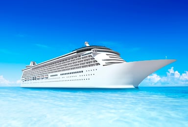 Cruise ship on a light blue sea.