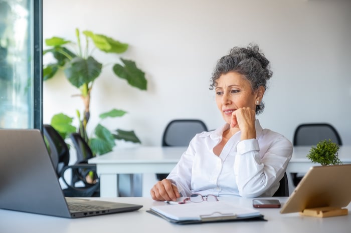 A person at a laptop.