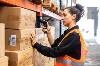 scanning boxes with bar code scanner in warehouse