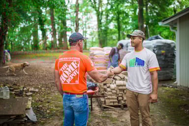 Home Depot worker shaking hands