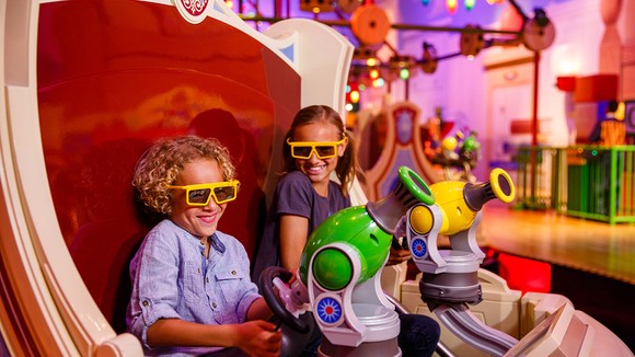 Guest enjoying the Toy Story Mania attraction at Disney's Hollywood Studios.