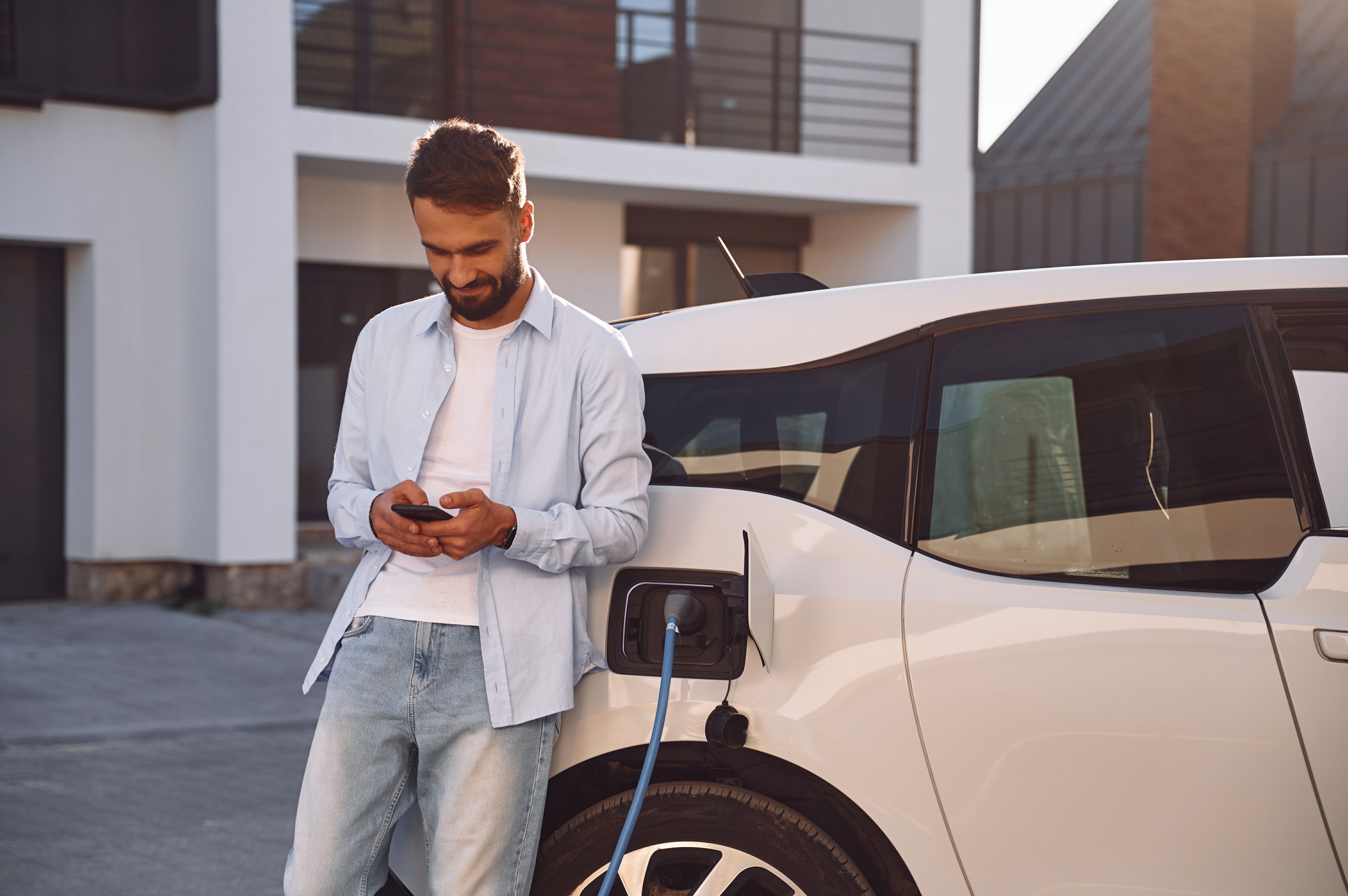 driver charges an electric vehicle.